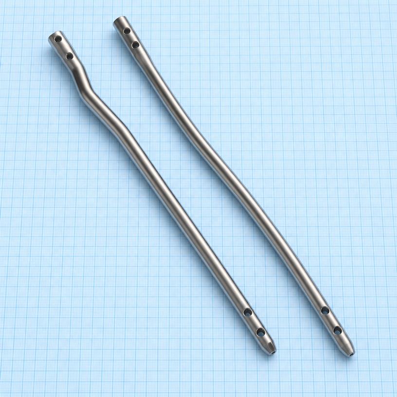 Interlocking Nail — Femur: orthopaedic implant on a light-blue graph-paper background