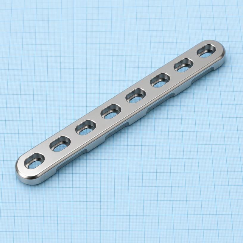 4.5/5.0 mm LC-DCP: orthopaedic implant on a light-blue graph-paper background